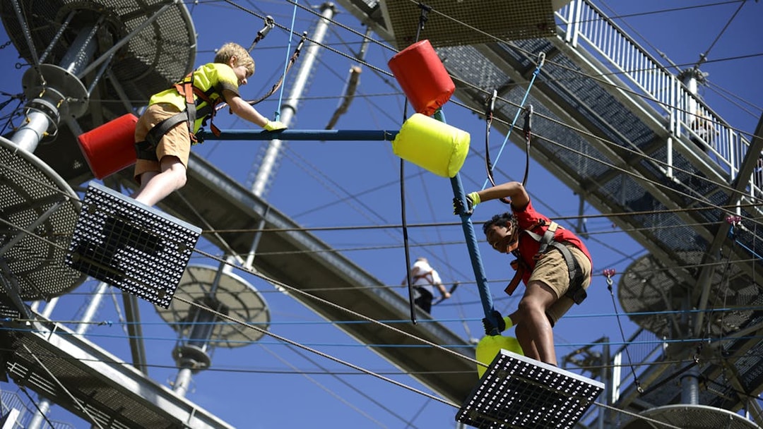 Children navigating a ropes course at West Beach Adventure.