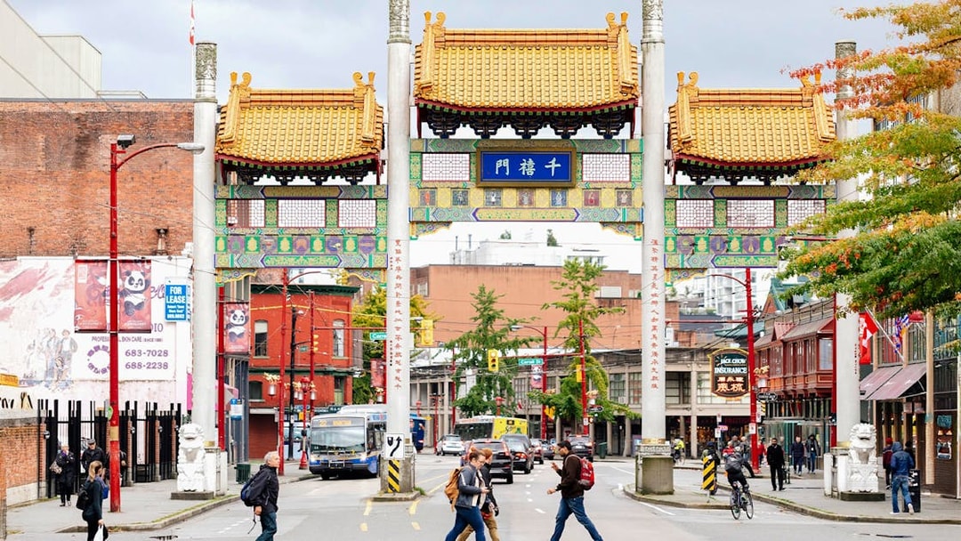 Vancouver Chinatown Millennium Gate with pedestrians and traffic.