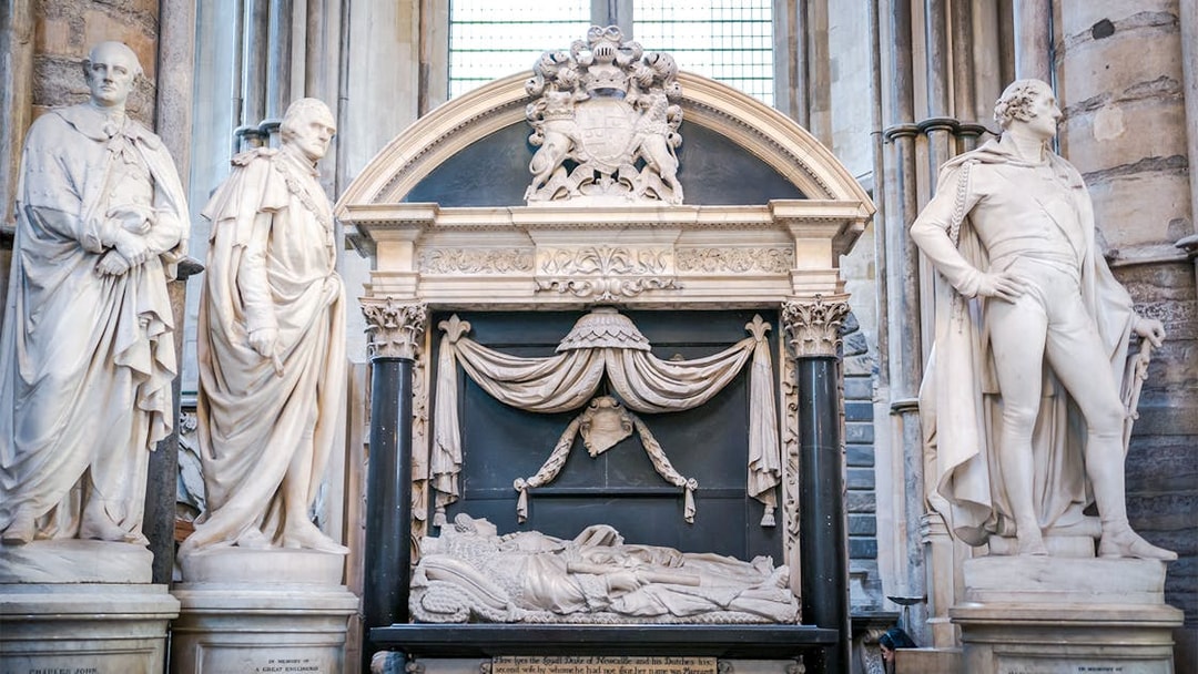 Sculptures and tomb in Poet's Corner, Westminster Abbey, London.