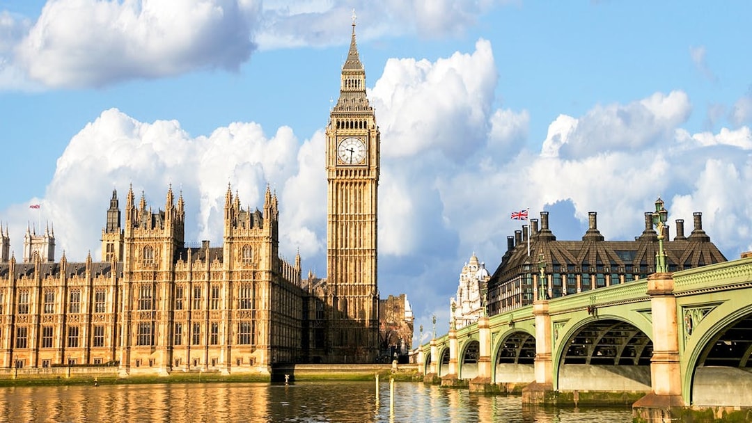 Big Ben and Houses of Parliament viewed from a Thames cruise in London.