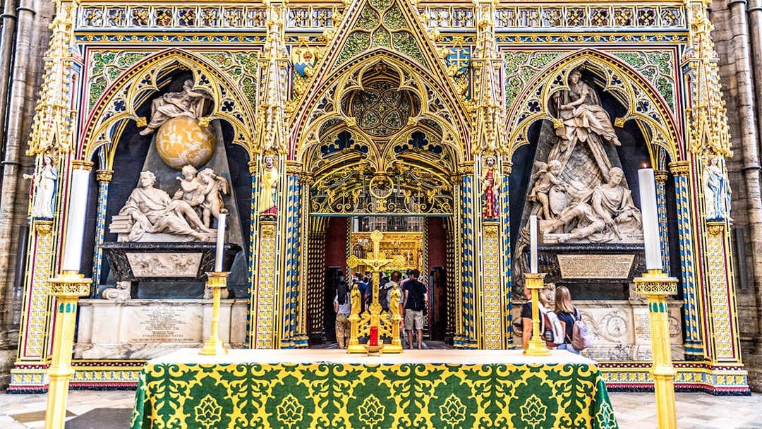 Sir Isaac Newton's Tomb in Westminster Abbey with ornate Gothic architecture.