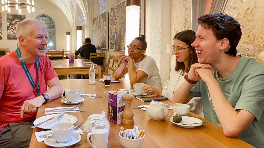 Group enjoying a discussion over tea during a private guided tour of Westminster Abbey.