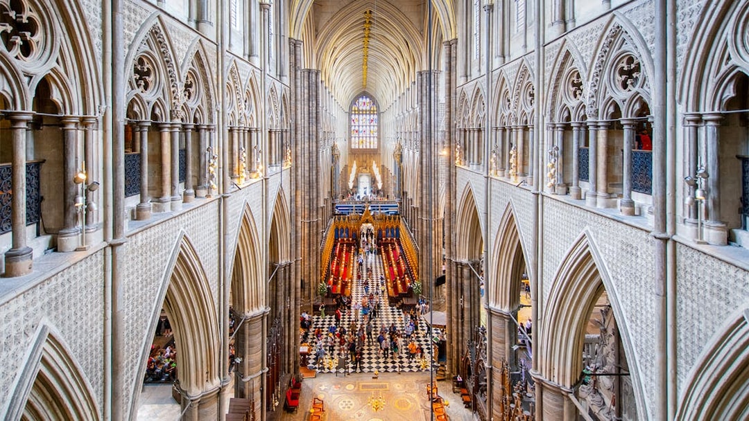 Westminster Abbey interior with view of Anglican Church architecture and stained glass.