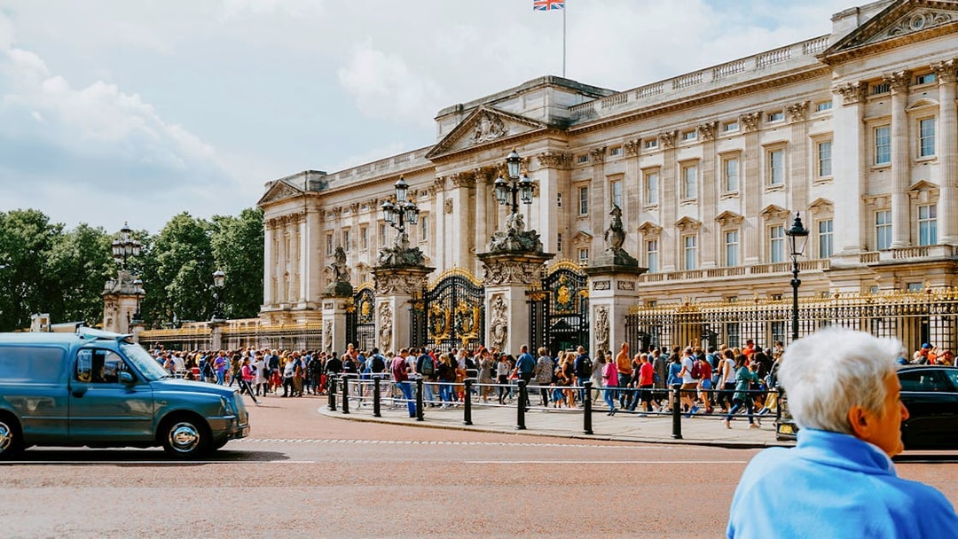 Crowd outside Buckingham Palace gates in London.