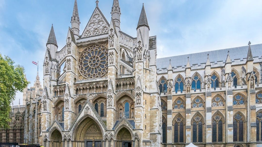 Westminster Abbey exterior with tourists, London.