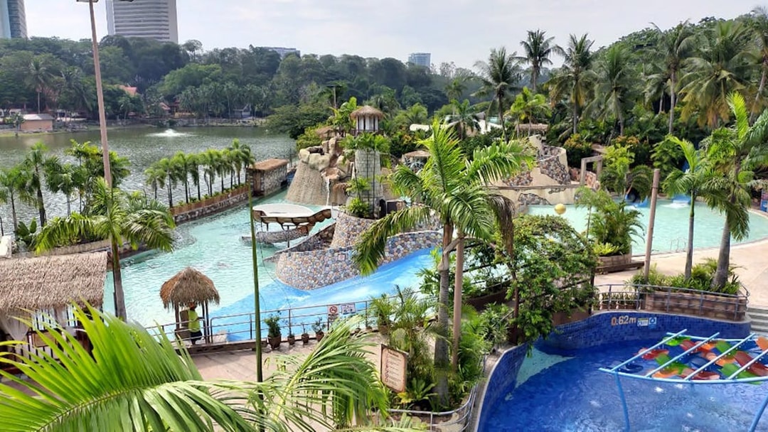 Wet World Water Park Shah Alam with pools, slides, and tropical landscaping.