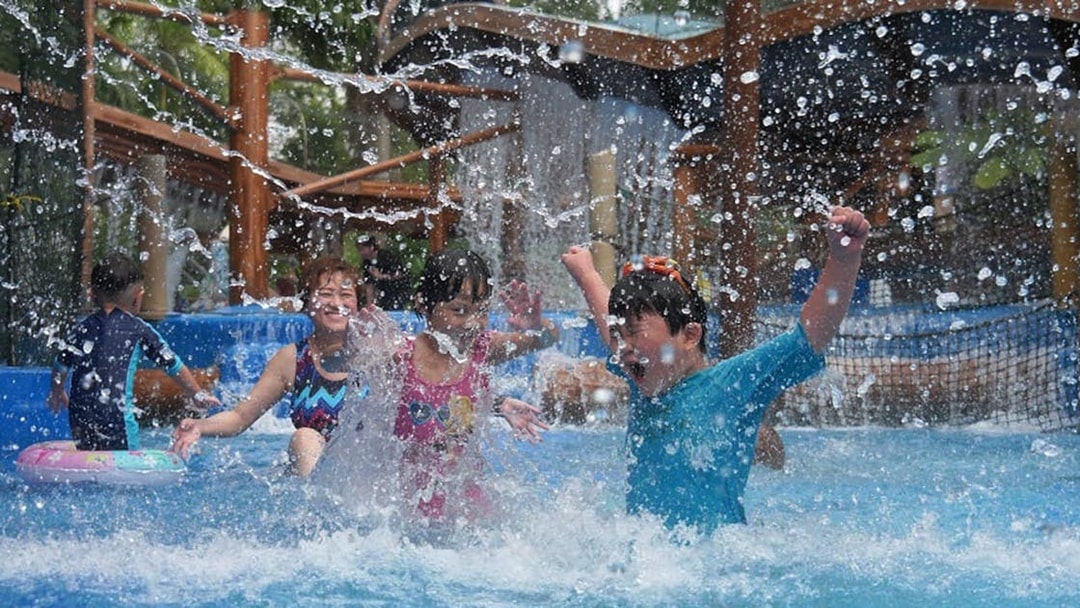 Children playing in a splash zone at Wet World Water Park Shah Alam.
