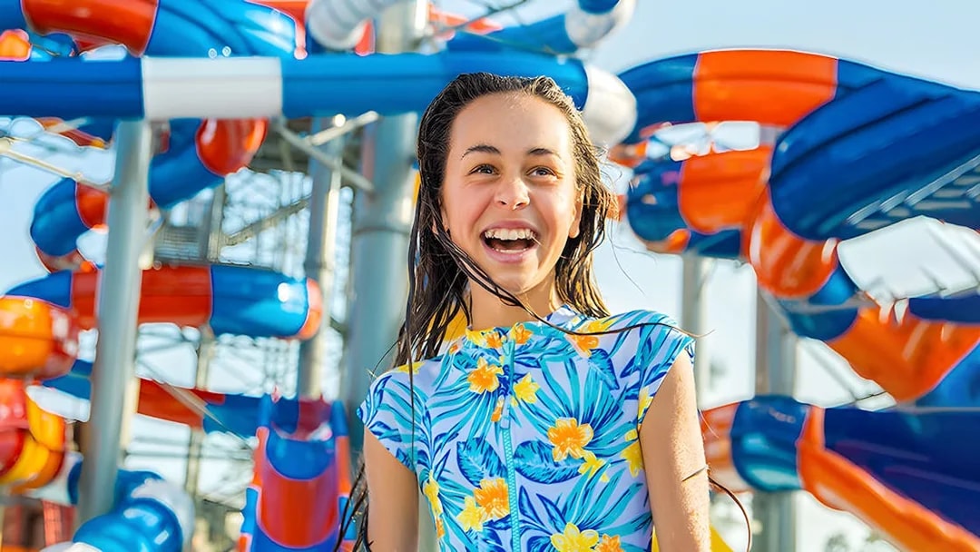 Child enjoying water slides at WhiteWater World, Gold Coast.
