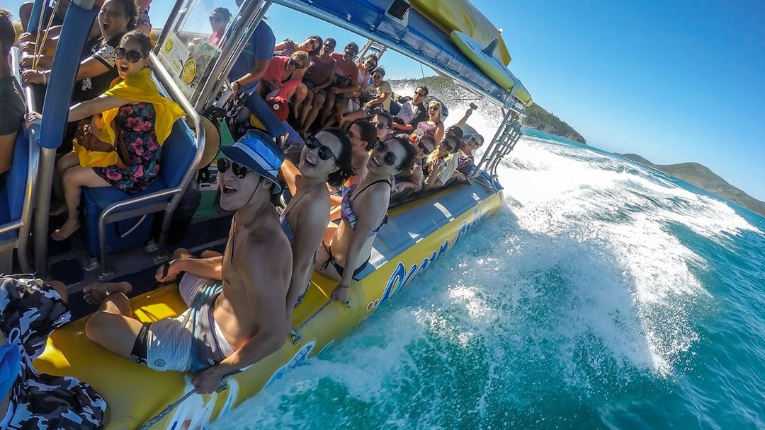 Group enjoying a speedboat ride in the Whitsundays, Australia.