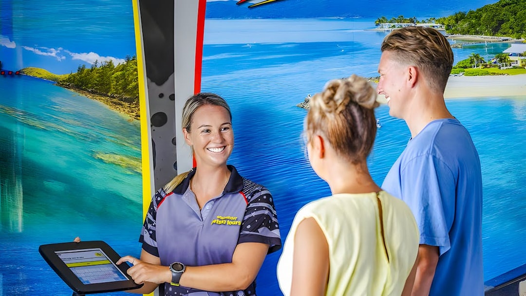 Tourists receiving jetski tour information from a guide in Whitsundays.
