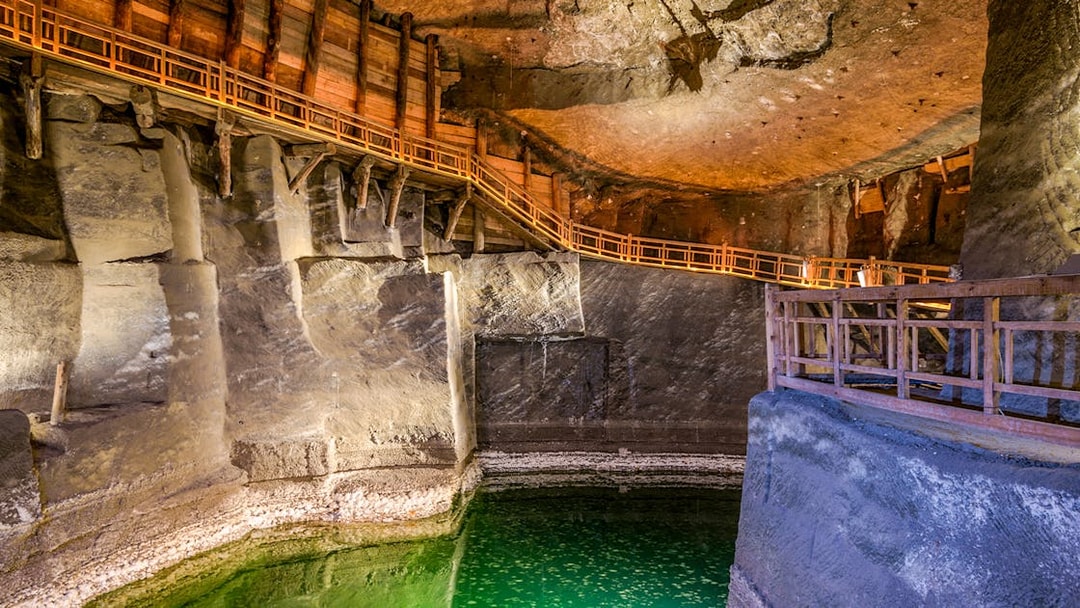 Underground lake with wooden walkways in Wieliczka Salt Mine, Poland.