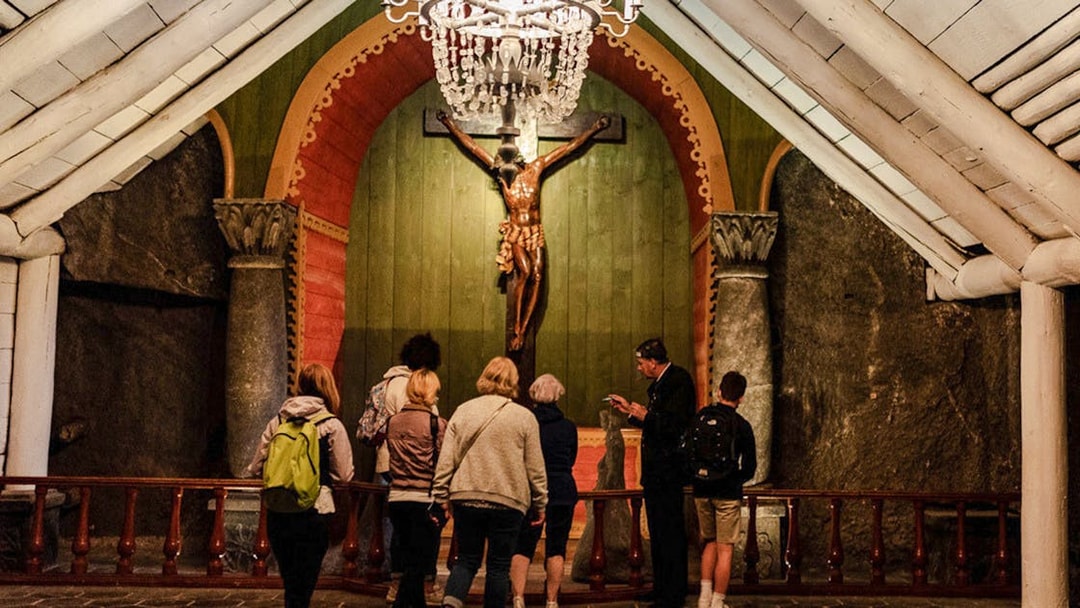 Tour group observing chapel interior at Wieliczka Salt Mine.