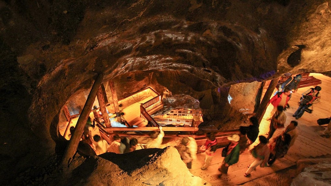 Visitors exploring underground tunnels at Wieliczka Salt Mine, Poland.