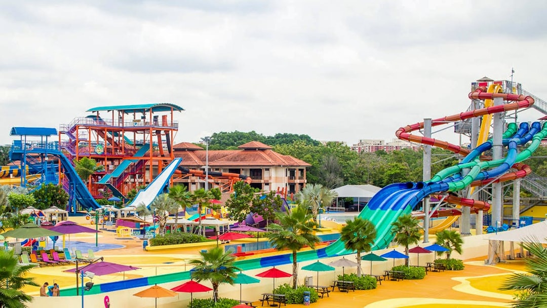 Water slides and colorful attractions at Wild Wild Wet water park in Singapore.