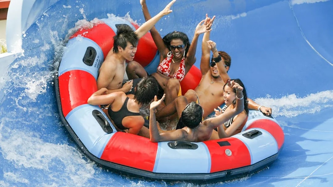 Group enjoying a raft ride at Wild Wild Wet water park, Singapore.