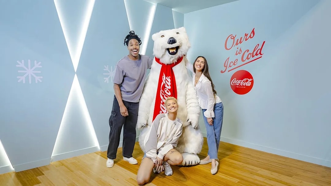 Friends posing with Coca-Cola bear at Coca-Cola Museum, Atlanta.