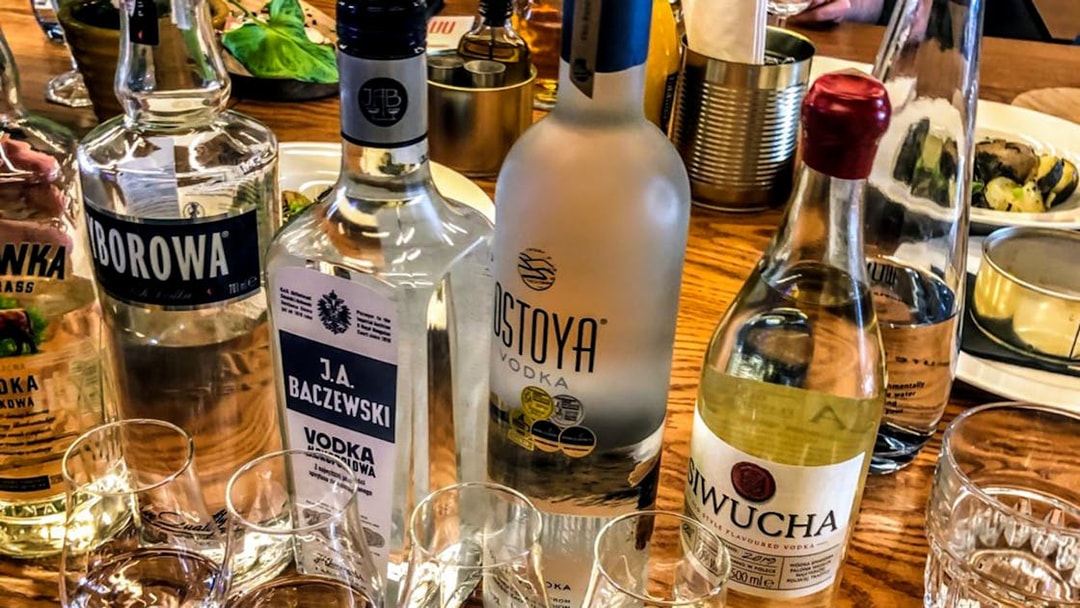 Vodka bottles and tasting glasses on a table in Wroclaw.