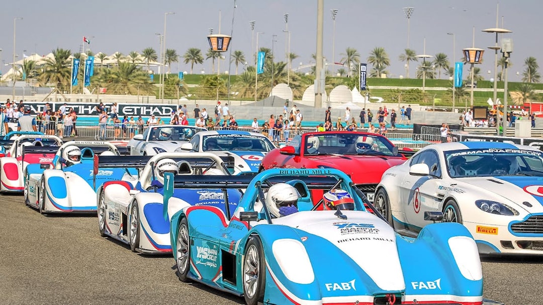 Race cars lined up for the YAS Radical SST Passenger experience at Yas Marina Circuit.