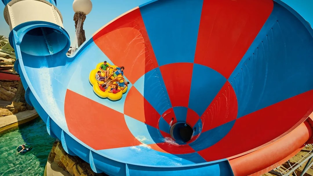 Rafting on Dawwama spiral water slide at YAS Waterworld, Abu Dhabi.