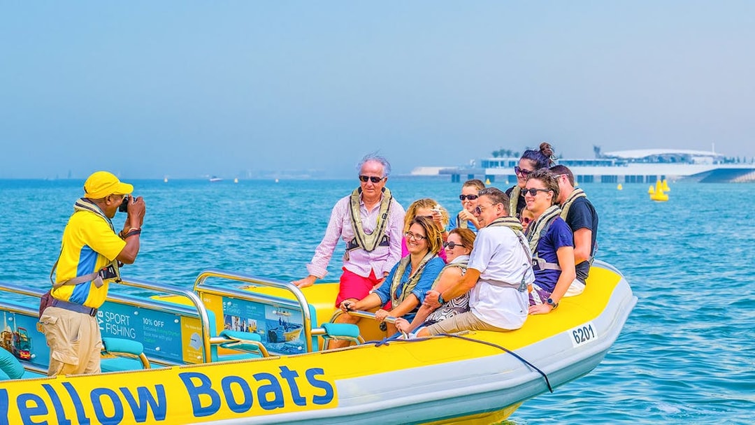 Group enjoying Dubai speedboat tour on the water.