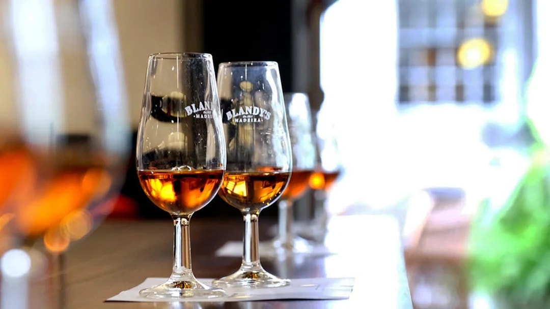 Wine glasses with Madeira wine at a tasting in Funchal, Portugal.