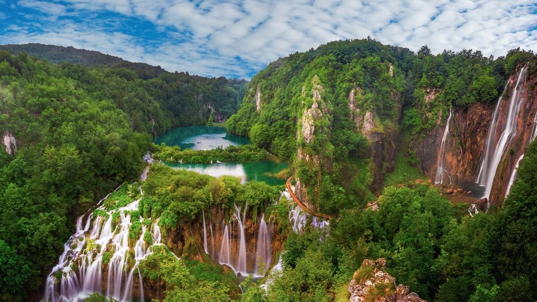 Plitvice Lakes waterfalls and lush greenery viewed from Zadar.
