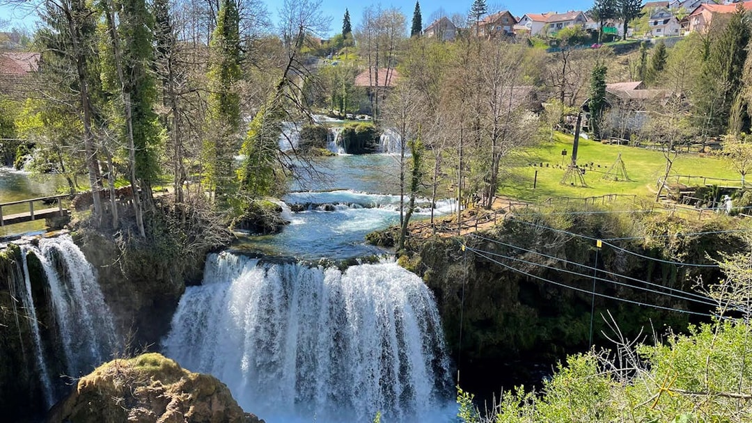 Waterfalls and greenery in Rastoke Village, Croatia, part of the Plitvice Lakes tour.