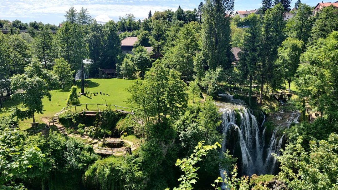 Waterfall and greenery in Rastoke Village, Croatia, part of the Plitvice Lakes tour.