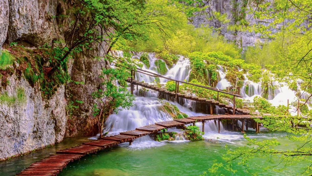 Wooden path over waterfalls at Plitvice Lakes National Park, Croatia.