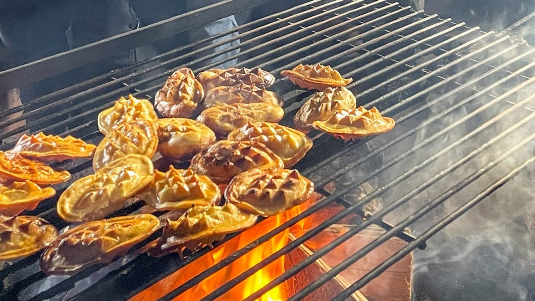 Traditional Polish smoked cheese grilling over open flames.