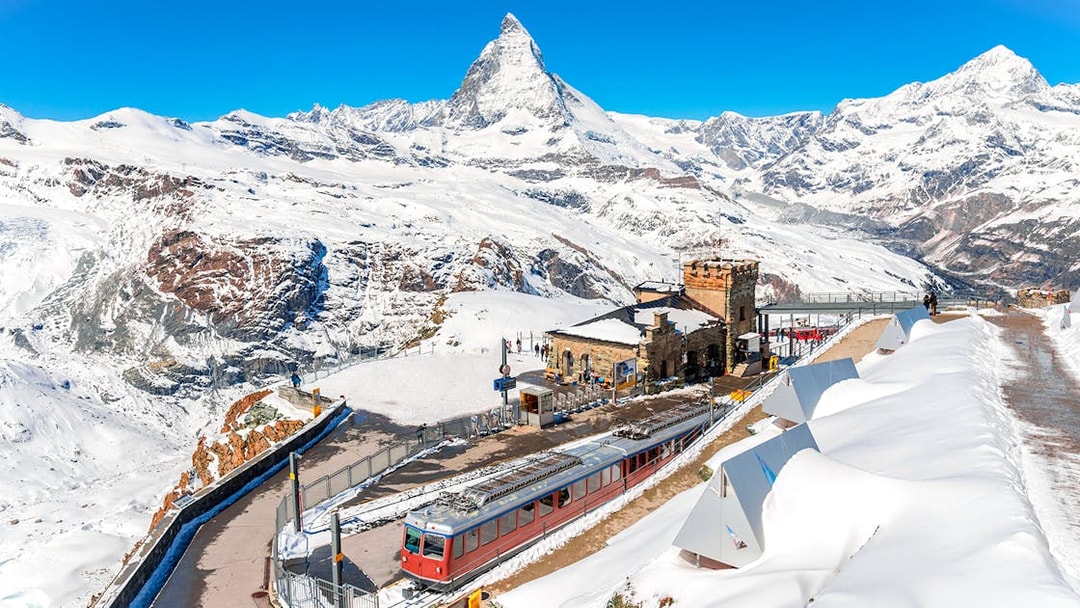 Gornergrat train at Gornergrat Railway Station with Matterhorn in the Swiss Alps.