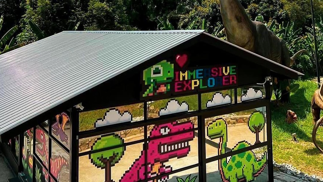Immersive Explorer building with pixel art dinosaurs at Zoo Melaka.