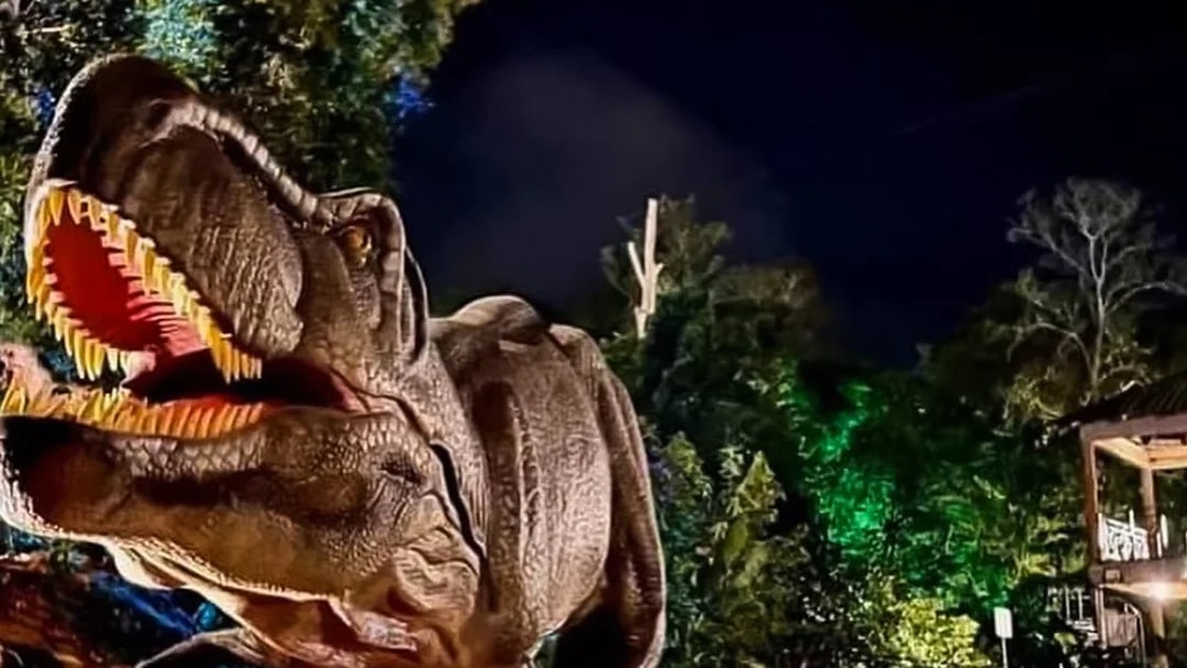 Dinosaur exhibit at Zoo Melaka at night.