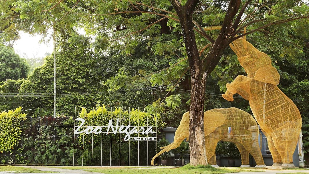 Zoo Negara entrance with elephant sculptures, Malaysia.