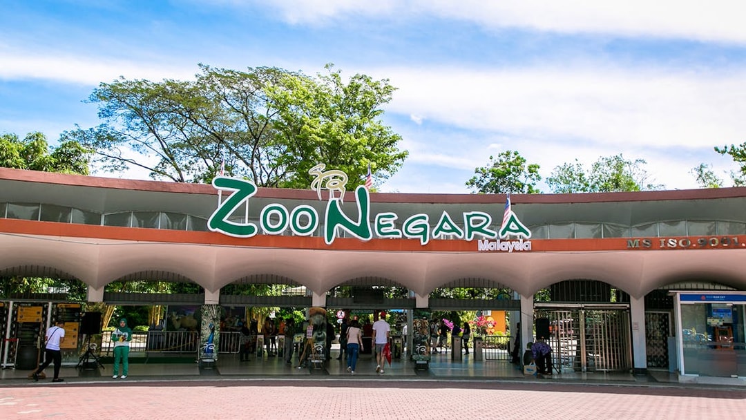 Zoo Negara entrance in Malaysia with visitors entering.