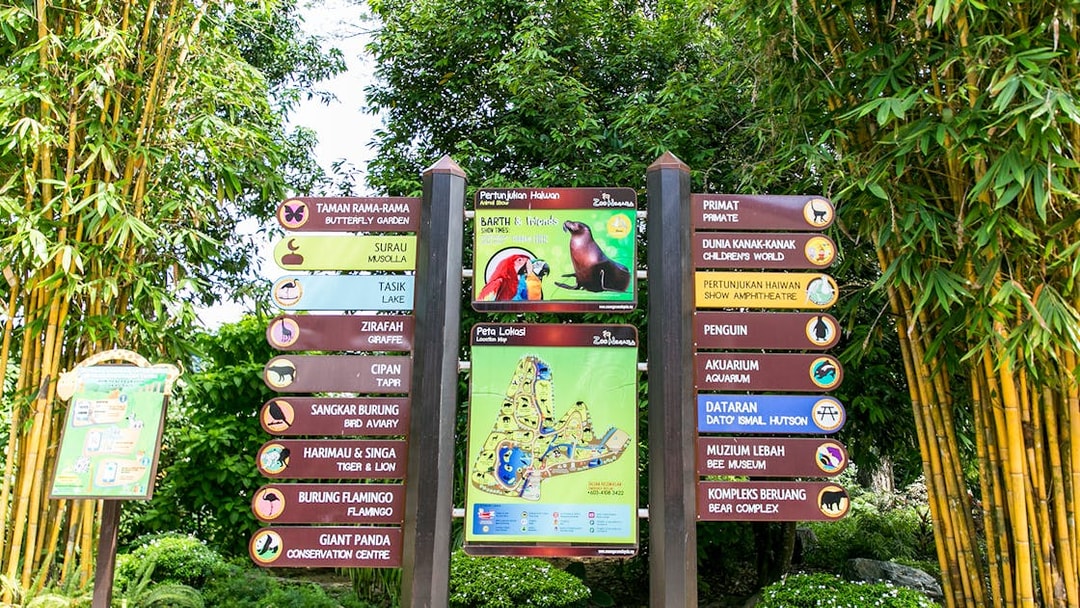 Zoo Negara signpost with directions to attractions including the Panda Conservation Centre.